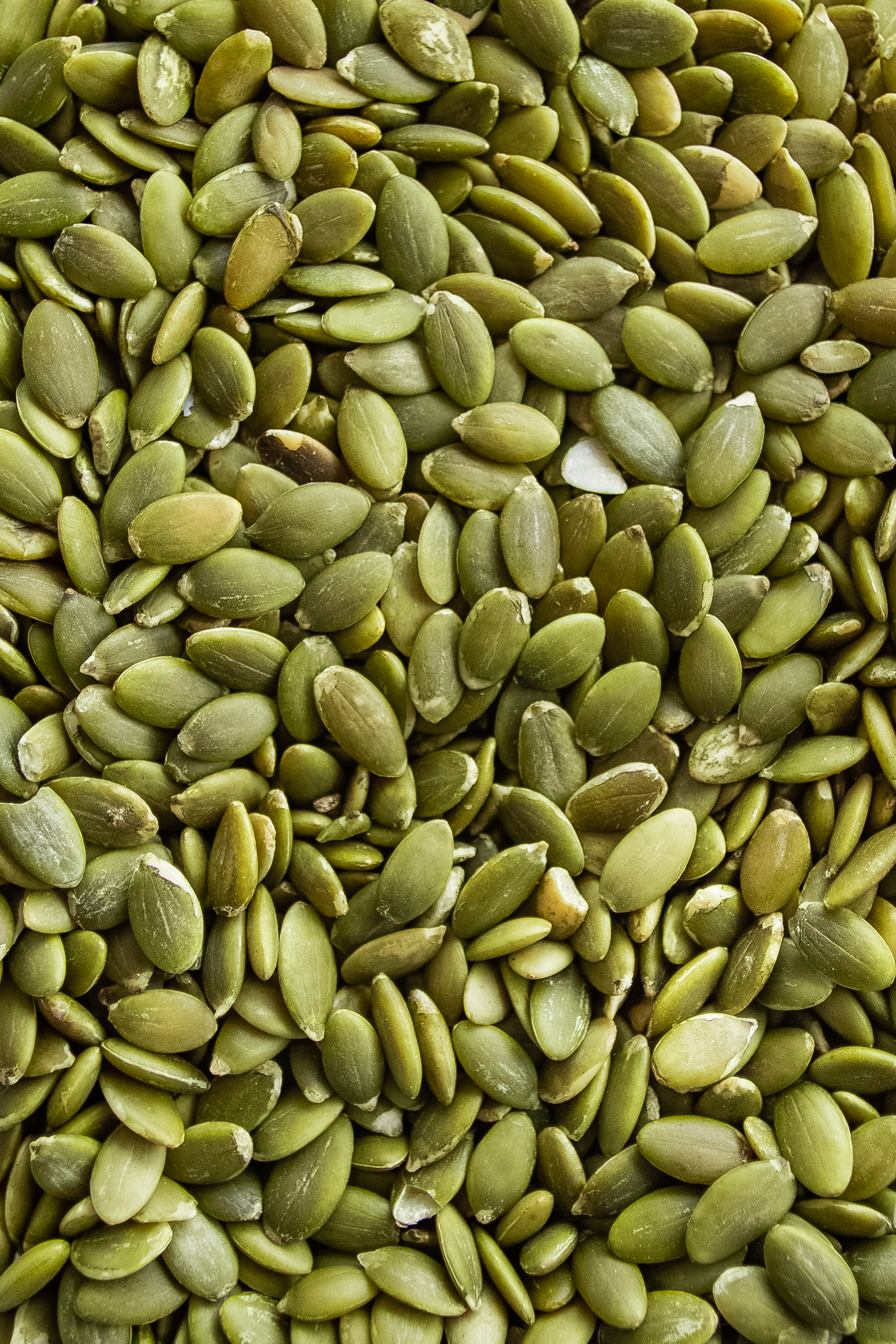 Close-up,Background,Texture,Of,Green,Pumpkin,Seeds.